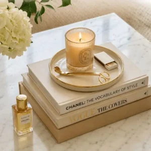 How to make your home look more expensive with elegant decor, neutral books, candles, marble textures, and sophisticated styling.