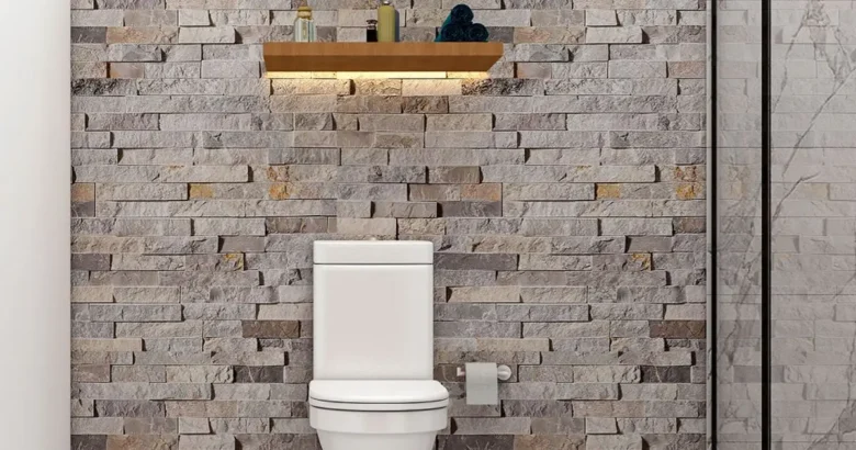 A modern minimalist bathroom sanctuary illustrating a Greek philosophy bathroom design with natural stone walls and warm lighting.