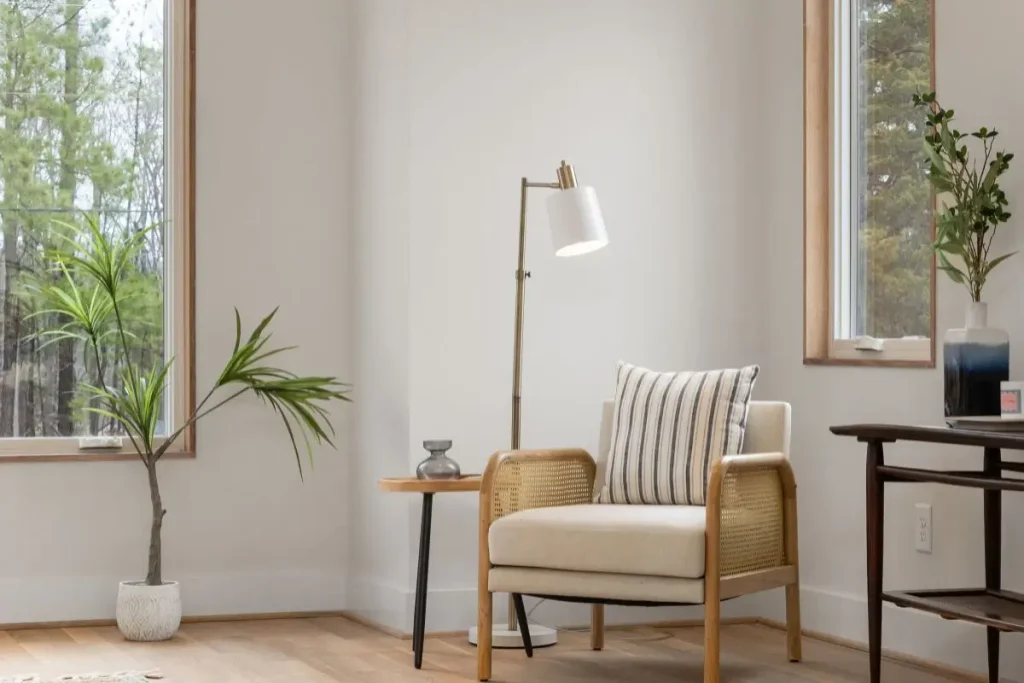 Warm living room with natural wood, indoor plants, woven furniture, and natural light